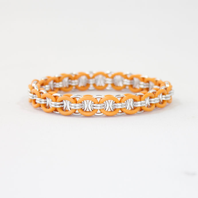 The Helm Stretch Bracelet in Orange + Silver